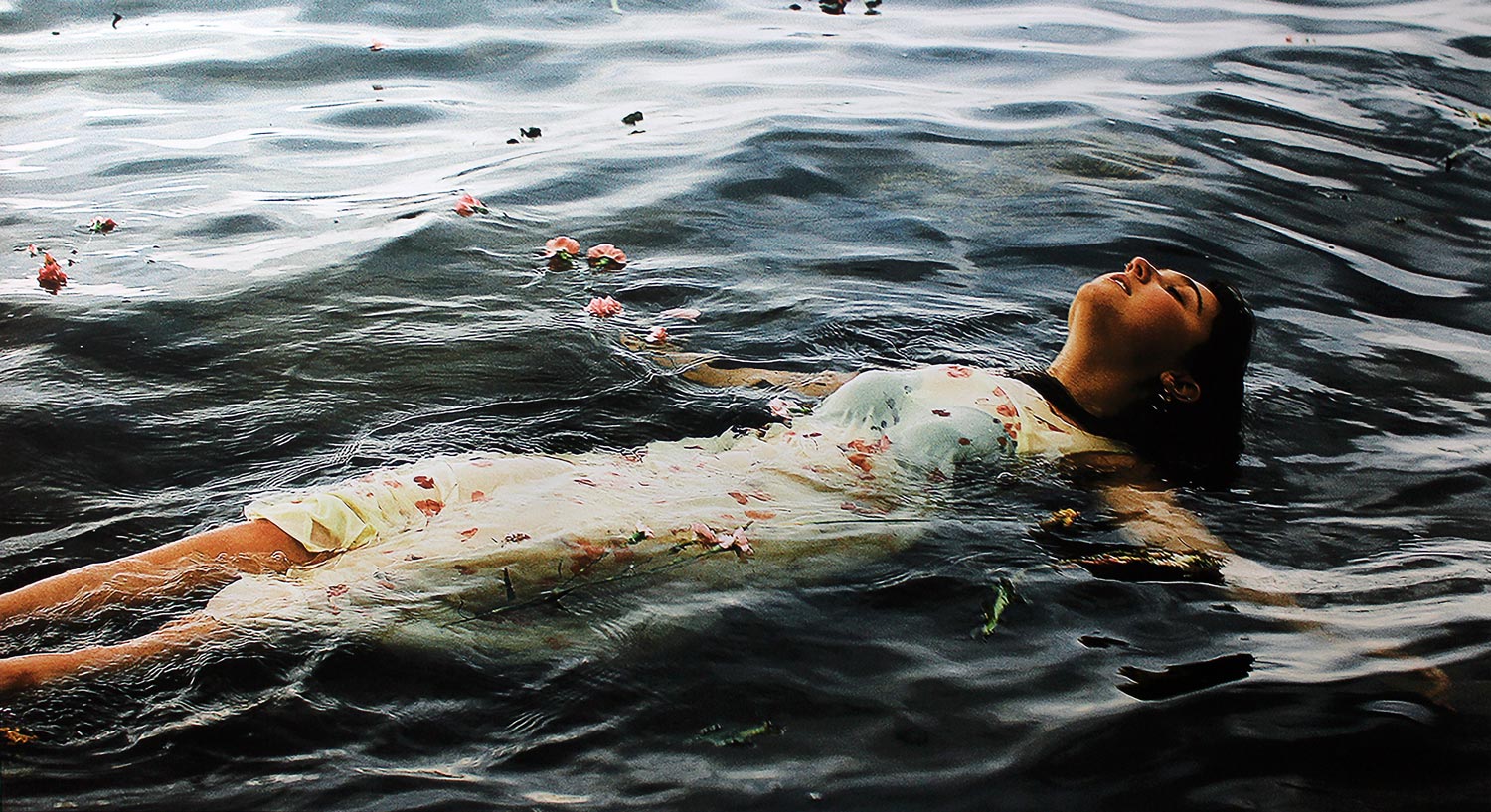 Student artwork of a girl floating in water