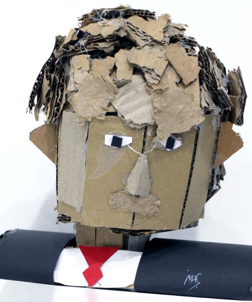 Student artwork of a cardboard portrait bust