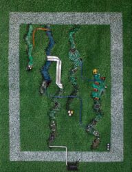 Artificial grass, paint, circuit boards and electrical wire assemblage by John Robinson, Year 12 Student artwork of circuit boards