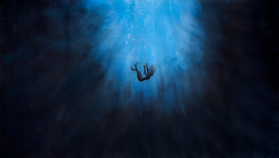 Gouache and charcoal on paper by Lucinda Papas, Year 11 Student artwork of a figure falling through water