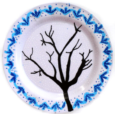 Student artwork of a plate with a tree