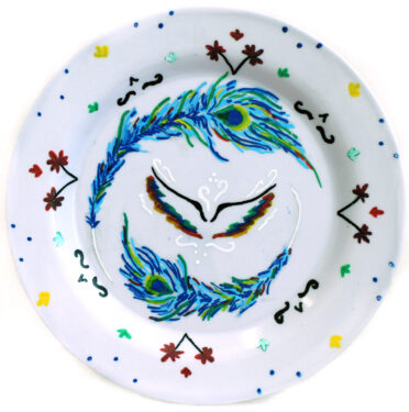 Student artwork of a plate with feathers