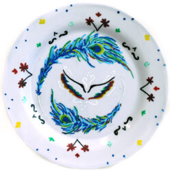 Student artwork of a plate with feathers