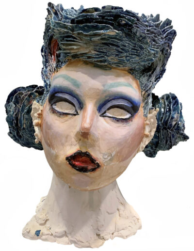 Student artwork of a glazed ceramic bust