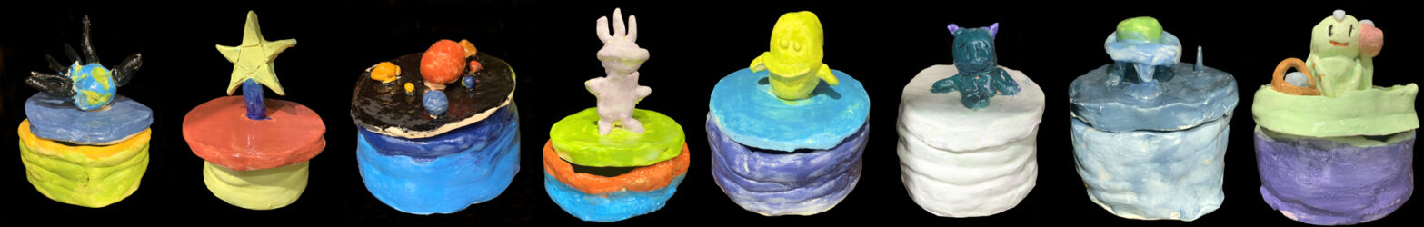 Student artwork of glazed ceramic pots