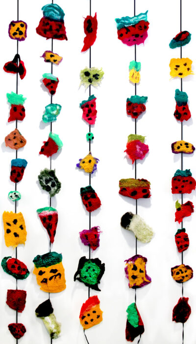 Felted Wool, a Group Project by Year 5 students at Fintona Girls’ School Student artwork of felt fruit on strings