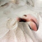 Photograph by Monique Astonino, Year 12, Huntingtower Student artwork of a face buried in sand