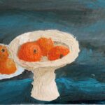Student artwork of a still life with oranges