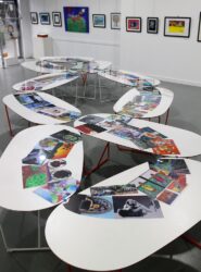Digital print collage on tables, a group work created by artworks images from the ISV Student Art Collection, shared at the Arts Learning Festival 2019 Student art of the third paradise symbol