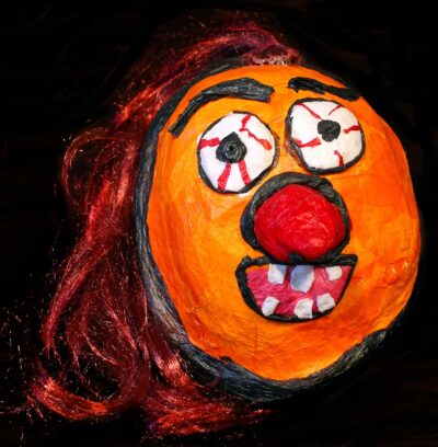 Student artwork of a mask with long nose
