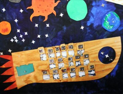 Acrylic on canvas, a group work by Junior School students, Korowa Anglican Girls’ School Student artwork of a rocket ship in space