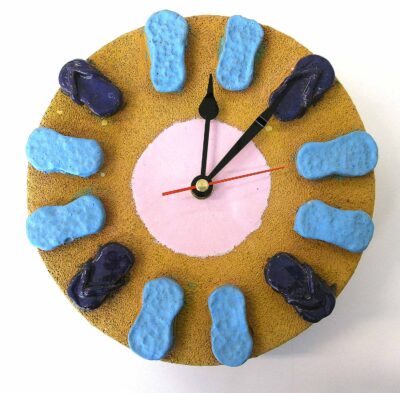 Raku clay, stains and glaze by Tahnee Streatfield, Year 9, Mentone Grammar Student artwork of a clock with thongs