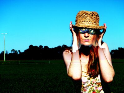 Photography by Alara Baldwin, Alexandra Phillips, Chelsea Hillas, Emily Kalafatis, Furat Alsabti, Gabbie Cirillo, Georgie Evans, Lauren Minicozzi, Margot Craig, Melanie Nixon, Mikaela Cowan, Natalie Sakarintr, Paul Prato, Rebecca Brun and Sarah Mitchell, Year 10, Goulburn Valley Grammar School Student photograph of a woman in a hat