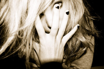 Photography by Alara Baldwin, Alexandra Phillips, Chelsea Hillas, Emily Kalafatis, Furat Alsabti, Gabbie Cirillo, Georgie Evans, Lauren Minicozzi, Margot Craig, Melanie Nixon, Mikaela Cowan, Natalie Sakarintr, Paul Prato, Rebecca Brun and Sarah Mitchell, Year 10, Goulburn Valley Grammar School Student photograph of a girl covering her face