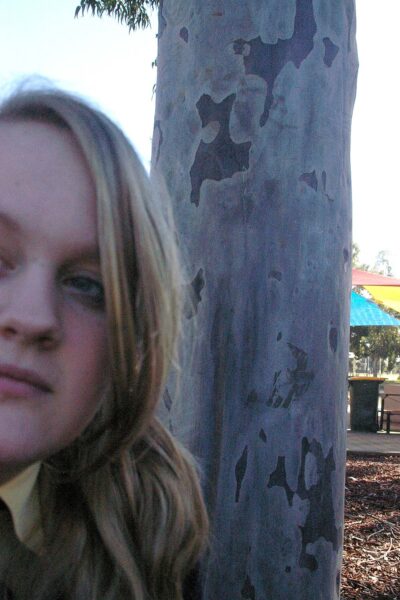 Photography by Alara Baldwin, Alexandra Phillips, Chelsea Hillas, Emily Kalafatis, Furat Alsabti, Gabbie Cirillo, Georgie Evans, Lauren Minicozzi, Margot Craig, Melanie Nixon, Mikaela Cowan, Natalie Sakarintr, Paul Prato, Rebecca Brun and Sarah Mitchell, Year 10, Goulburn Valley Grammar School Student photograph of a girl and a tree