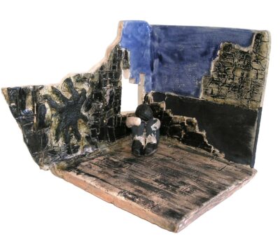 Student sculpture of a person sitting alone