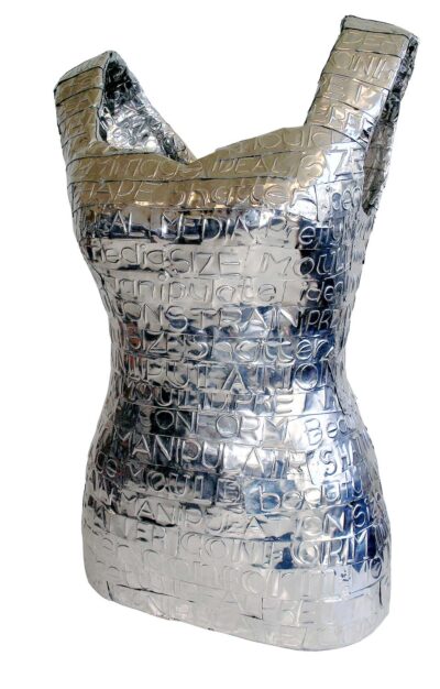 Student artwork of a silver dress with writing on it