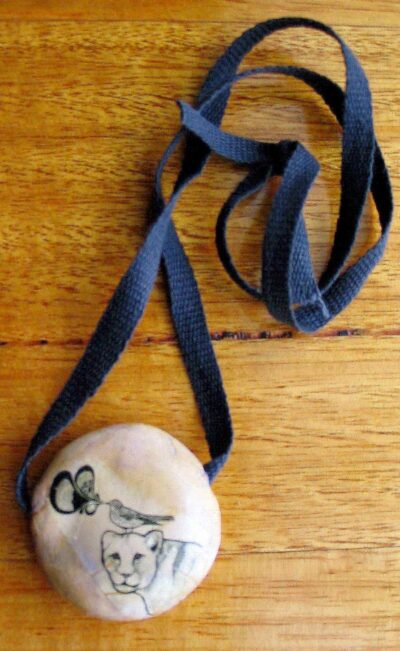 Ceramic and lazertran transfer paper by Claire Jungwirth, Year 11, Beaconhills College Student artwork of a ceramic necklace