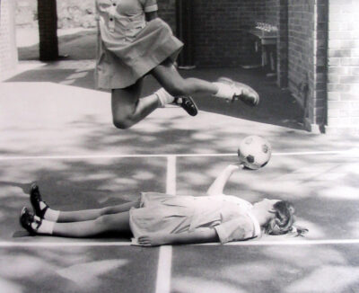 Black and white photograph by Taran Gill, Year 10, Fintona Girls’ School Student artwork of a student jumping over another
