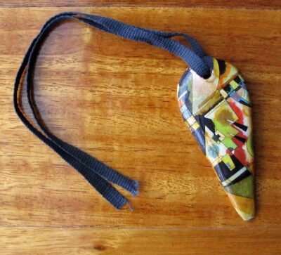 Ceramic and lazertran transfer paper by Frith Power, Year 11, Beaconhills College Student artwork of a ceramic necklace