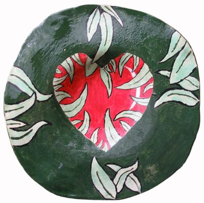 Student artwork of a plate with a heart and leaves