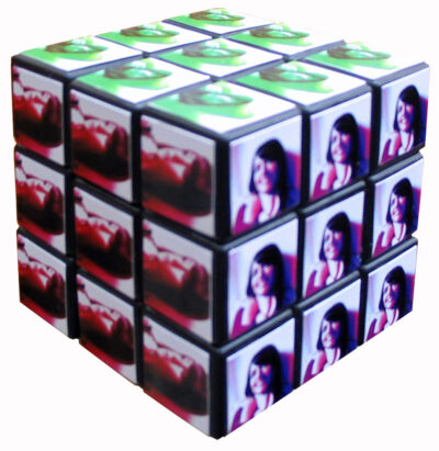 Student artwork of a rubics cube with portrait photos