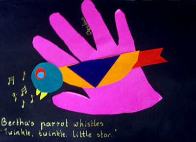 Collage on cardboard by Declan, Cheshire School Student artwork of a hand with parrot