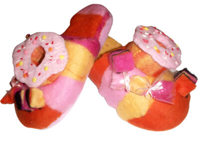 Student artwork of felt slippers with doughnuts and lollies