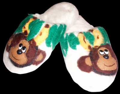 Student artwork of felt slippers with monkeys