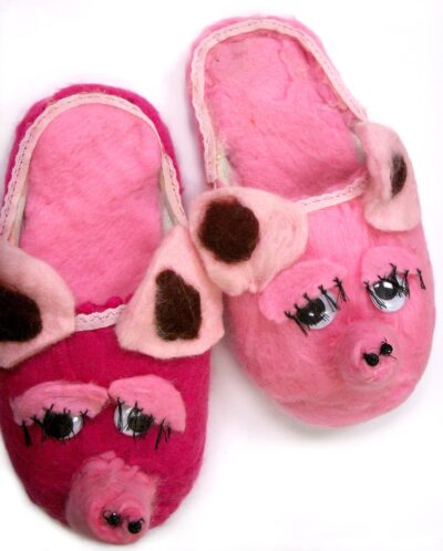 Student artwork of felt slippers with pigs