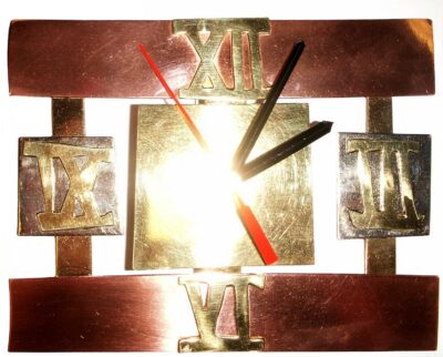 Student artwork of a metal clock in the shape of an open square