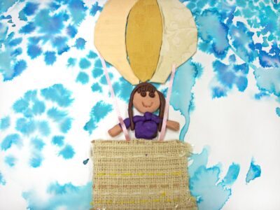 Mixed media on paper by Nicola Karris, Year 4, Oakleigh Grammar Student artwork of a girl in a hot air balloon