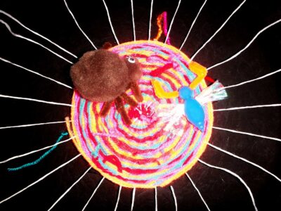 Woven fibres on pizza tray by Benjamin Wu, Year 1, Scotch College Student artwork of a spiderweb sculpture