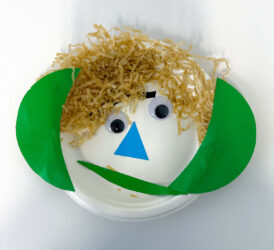 Student artwork of a paper plate face