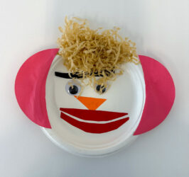 Student artwork of a paper plate face