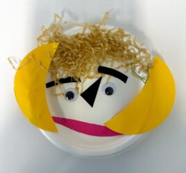 Student artwork of a paper plate face