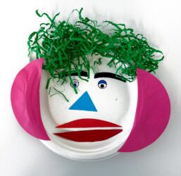 Student artwork of a paper plate face