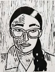 Student artwork of a lino print portrait