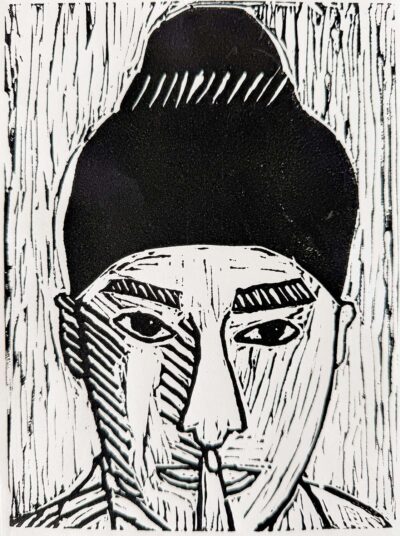 Student artwork of a lino print portrait